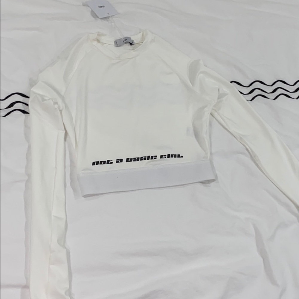 white cropped long sleeve shirt